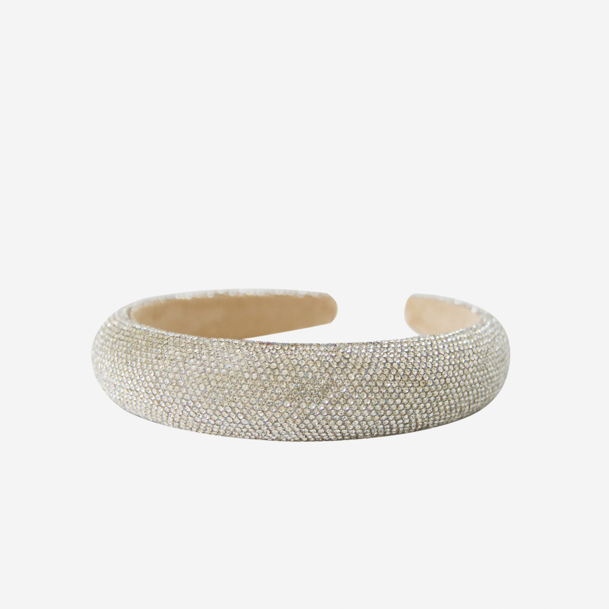 Crystal pave headband on an off white background