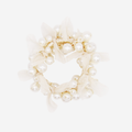 Pearl and organza beaded hair tie on an off white background