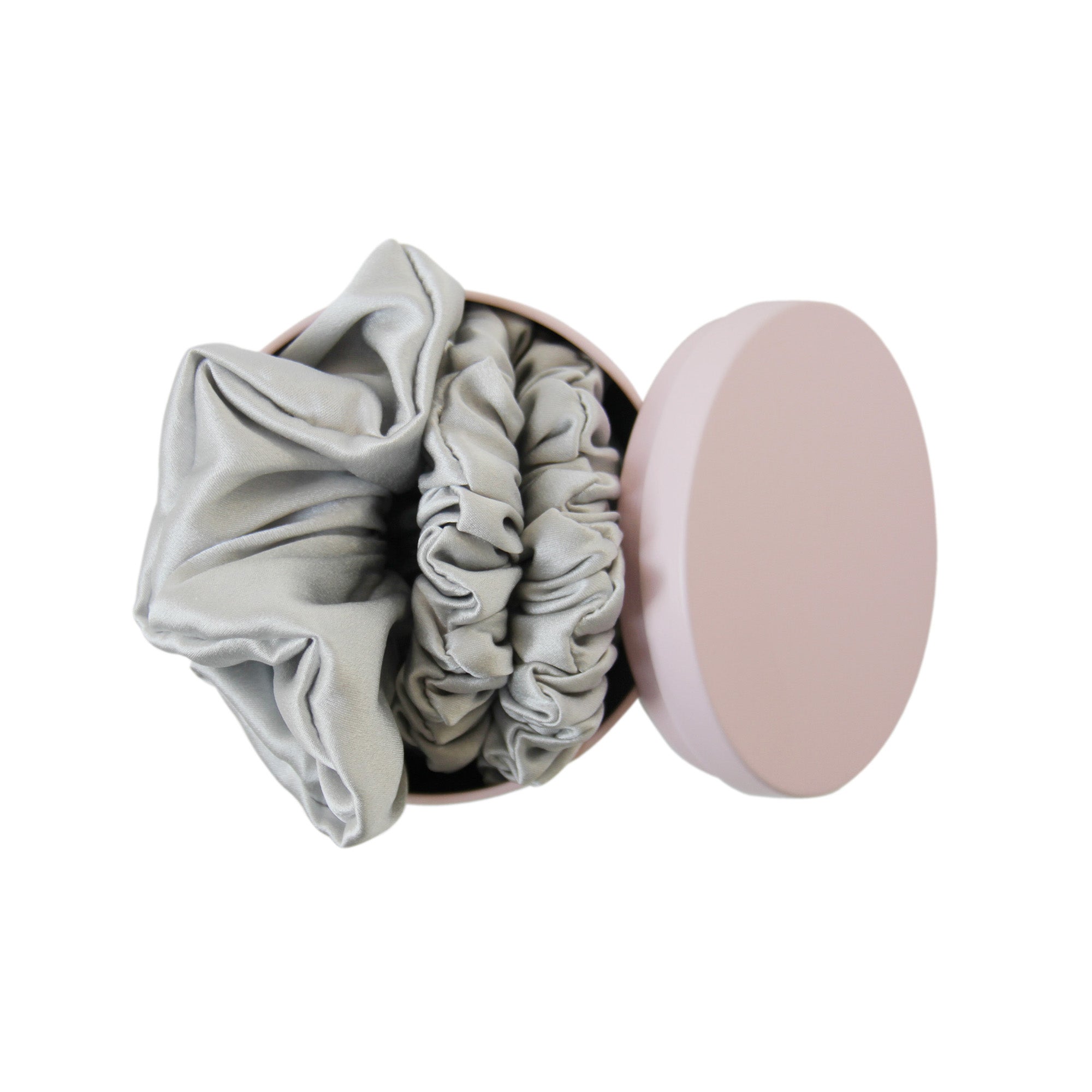 Pink Braid & Bow tin with three silver silk scrunches on a white background