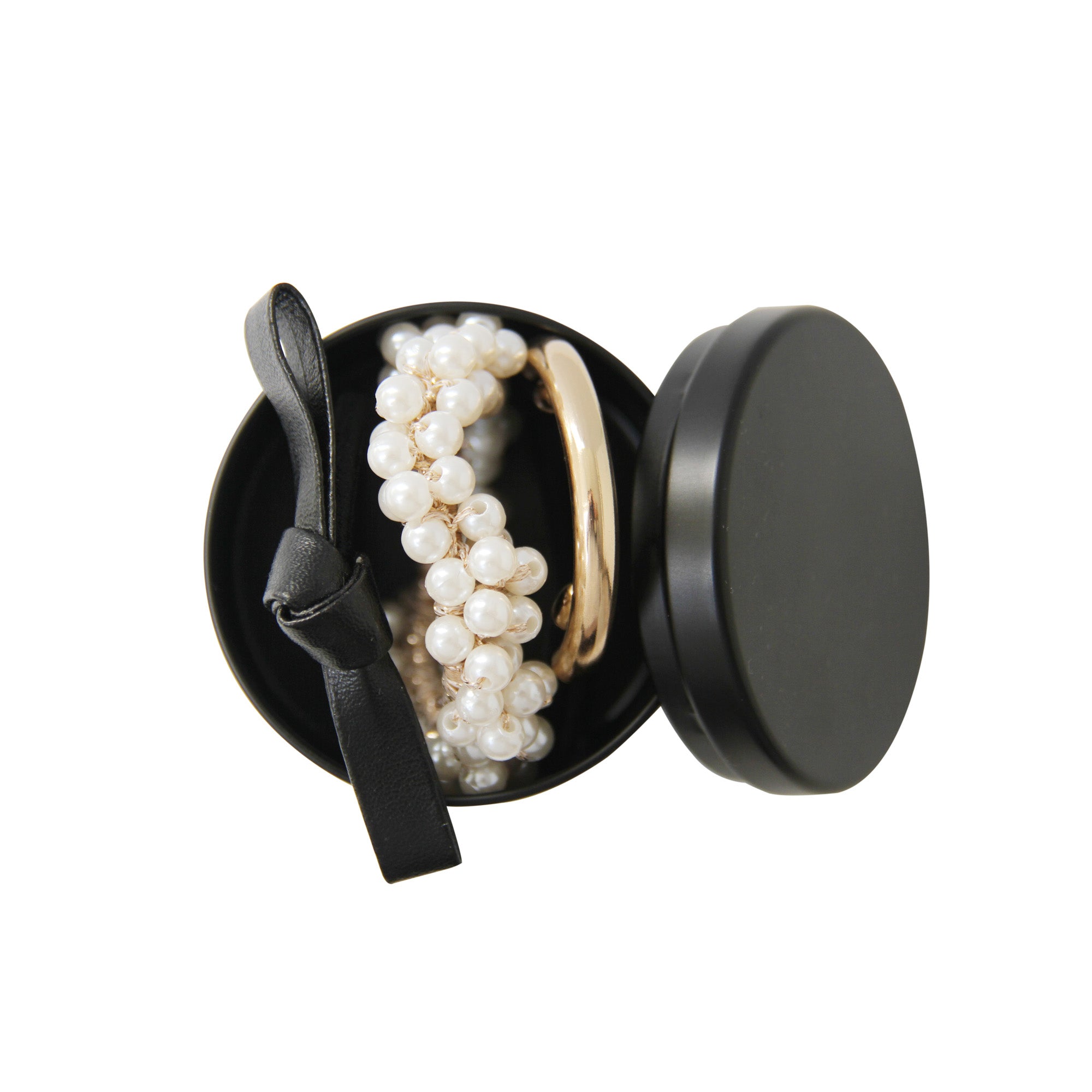 Braid & Bow ponytail kit, feauting a blow bow hair tie and pearl hair tie and a gold ponytail holder in a black tin