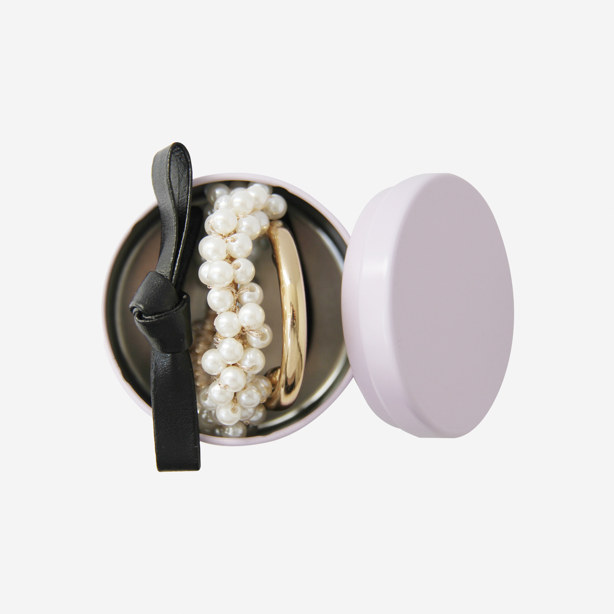 The Ponytail Kit From Braid & Bow, black keepsake ti includes black blow hair tie, pearl and gold hair tie and a gold metal glossy hair  tie