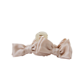 Blush bow hair claw on a white background