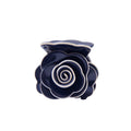 Navy blue rose-shaped hair claw on a white background