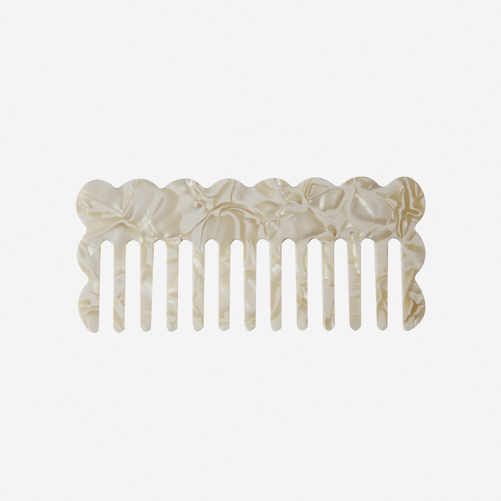 Scalloped mother of pearl wide tooth resin hair comb that's great for detangling and styling
