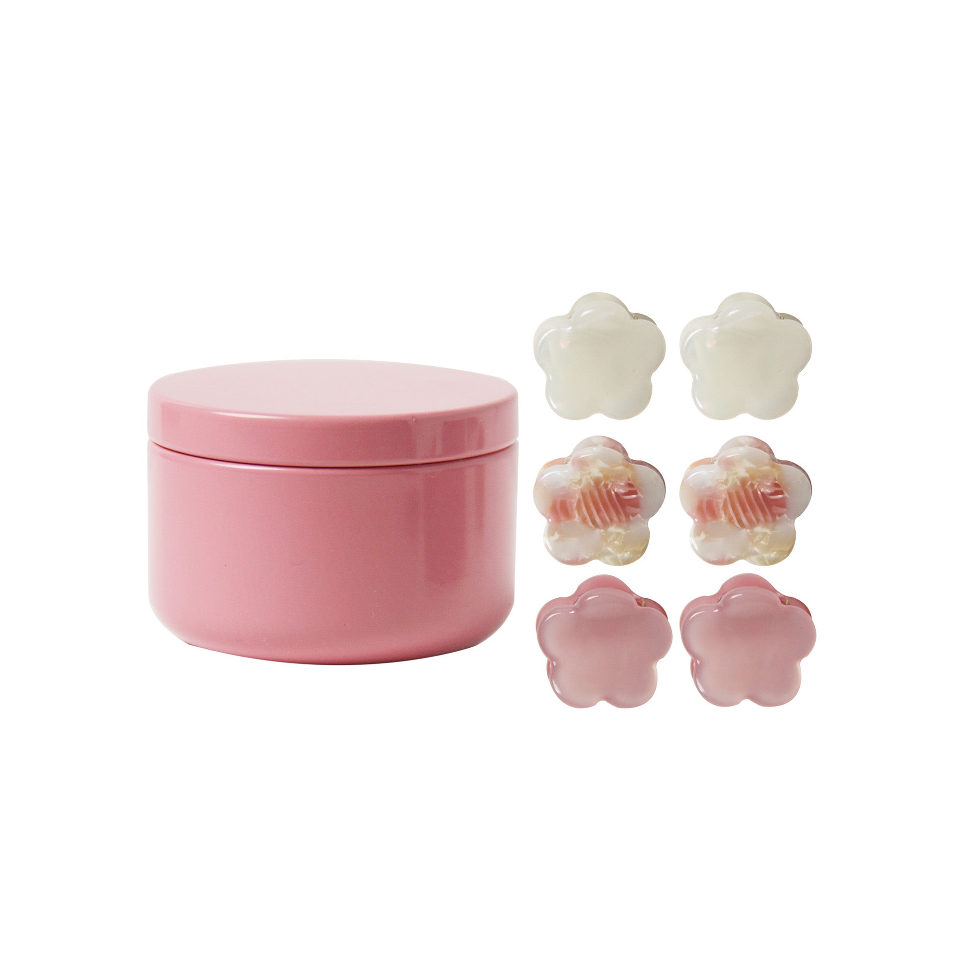 set of 6 mini hair claws next to the pink tin they come in on a white background