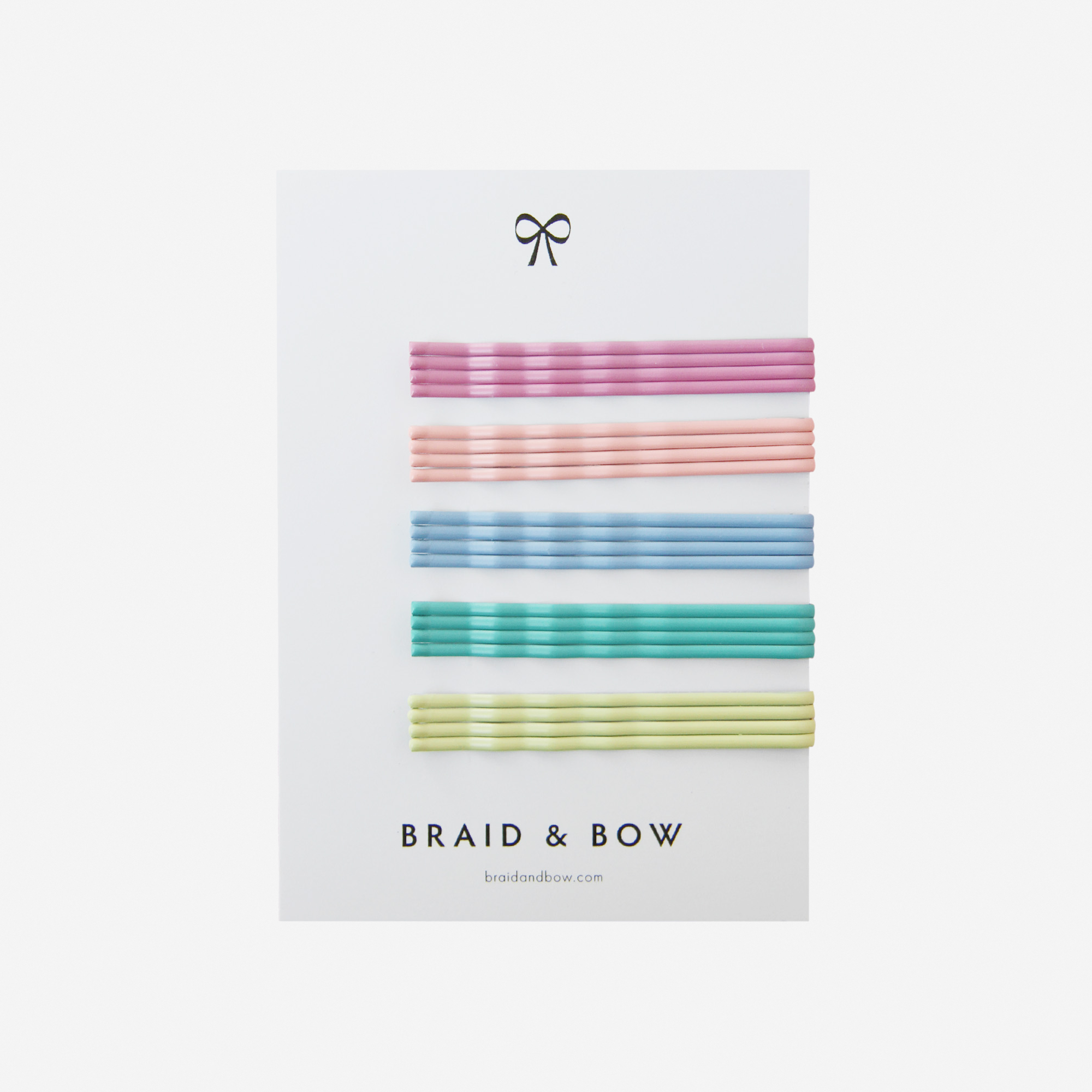 Set of 20 vivid colourful kirby grips on a white Braid & Bow white card