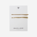 Set of 2 gold hair slides in an irregular organic shape, on a white card