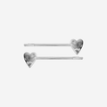 Set of 2 two silver heart hair slides on an off white background