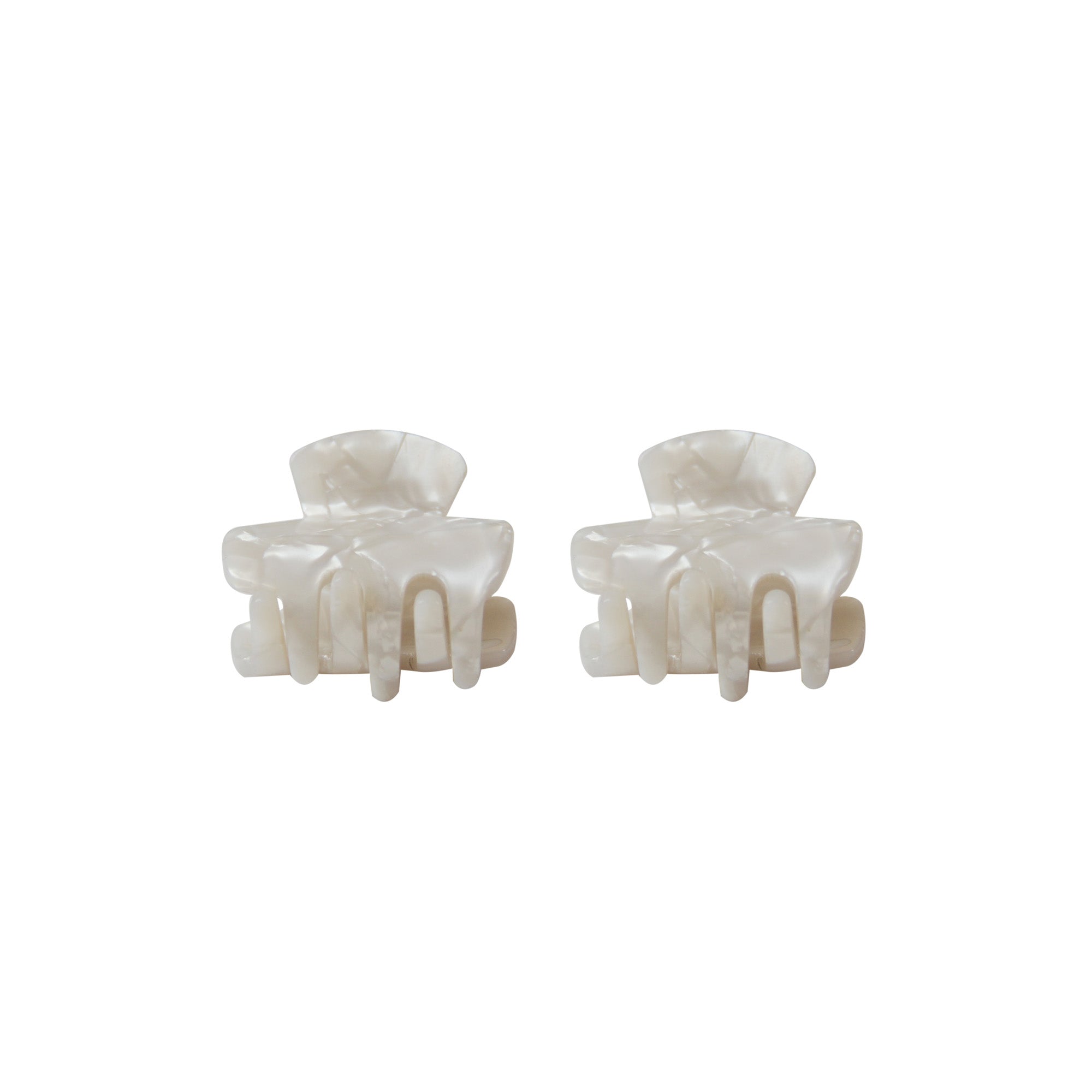 Pair of white mother of pearl resin hair claws on a white background