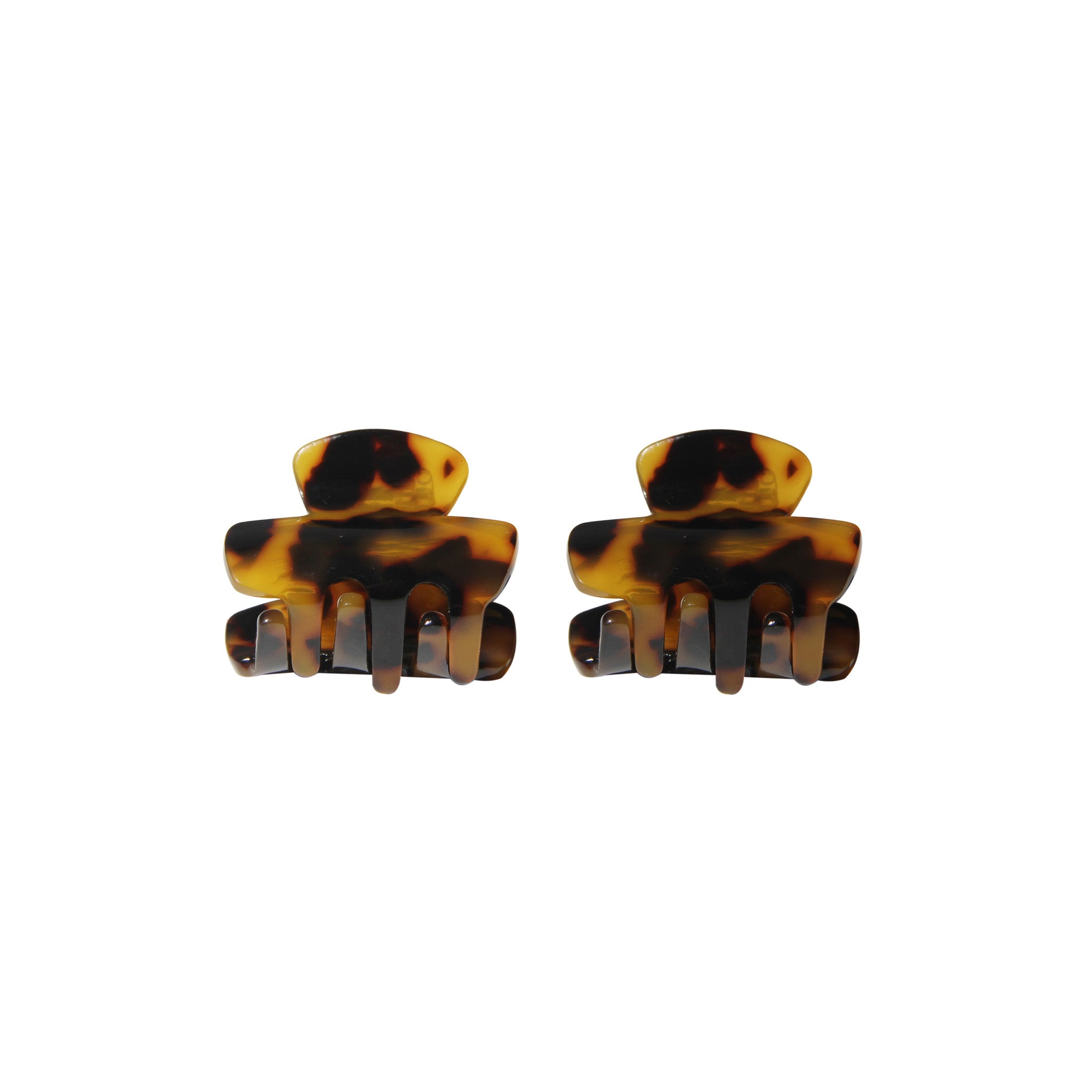 Pair of tortoiseshell hair claws on a white background