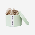 Set of 3 champagne silk scrunchies in green keepsake tin, that they come packaged in and you can store them in, a great gift