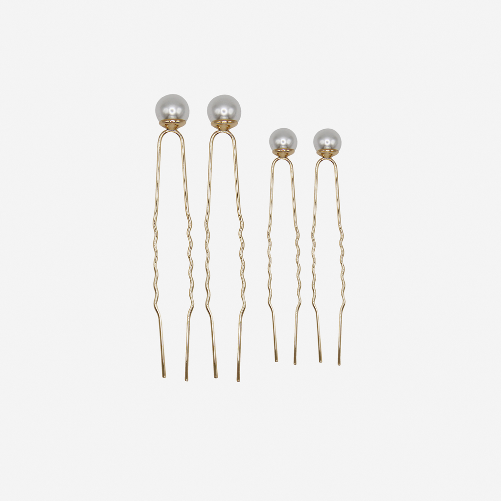 Set of 4 gold and pearl hair pins, 2 large size, 2 small size on an off white background