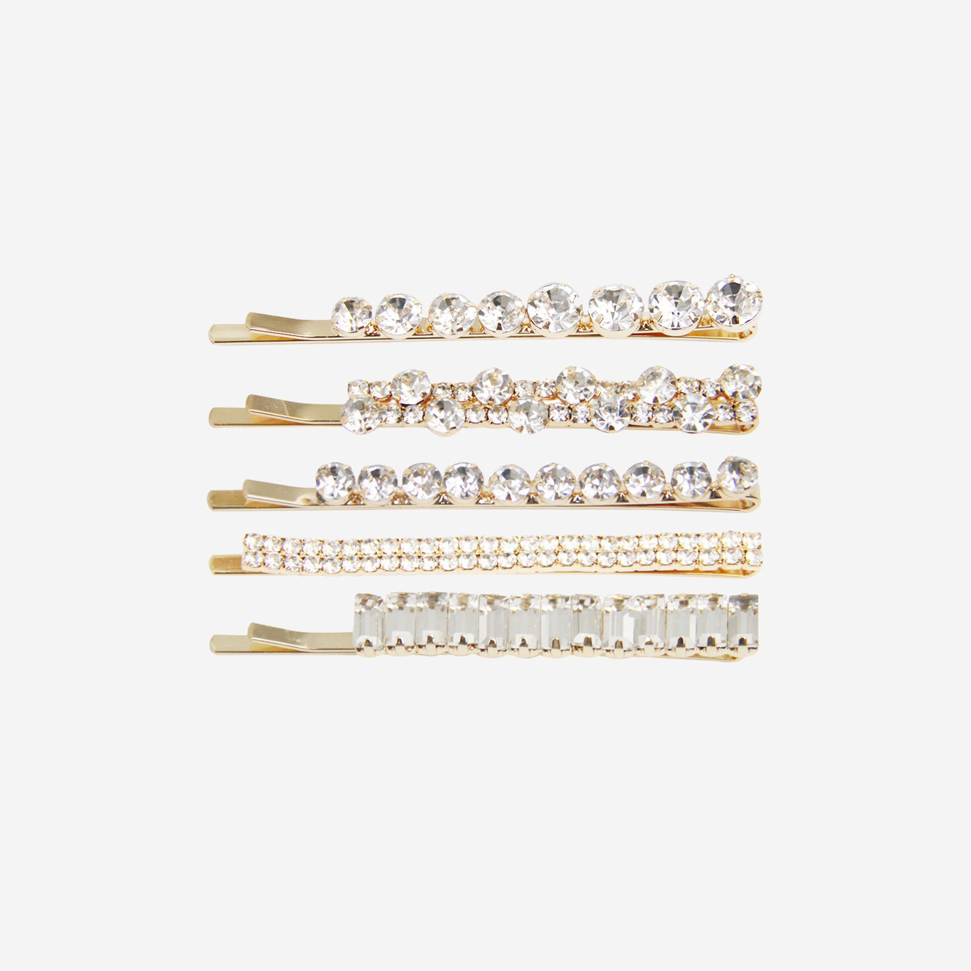 Set of 5 gold crystal hair slides, all 5 have a different design, on an off white background