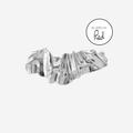 Silver creased hair clip on an off white background, featuring an as seen in Red magazine logo