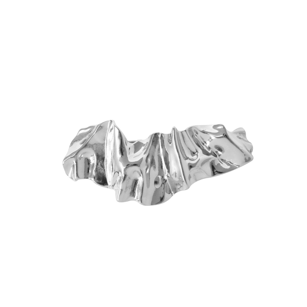 Silver creased hair clip on a white background