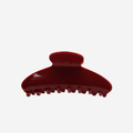  Burgundy oval hair claw on an off white background