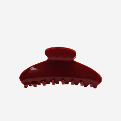  Burgundy oval hair claw on an off white background