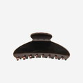 Chocolate Brown oval hair claw on an off white background