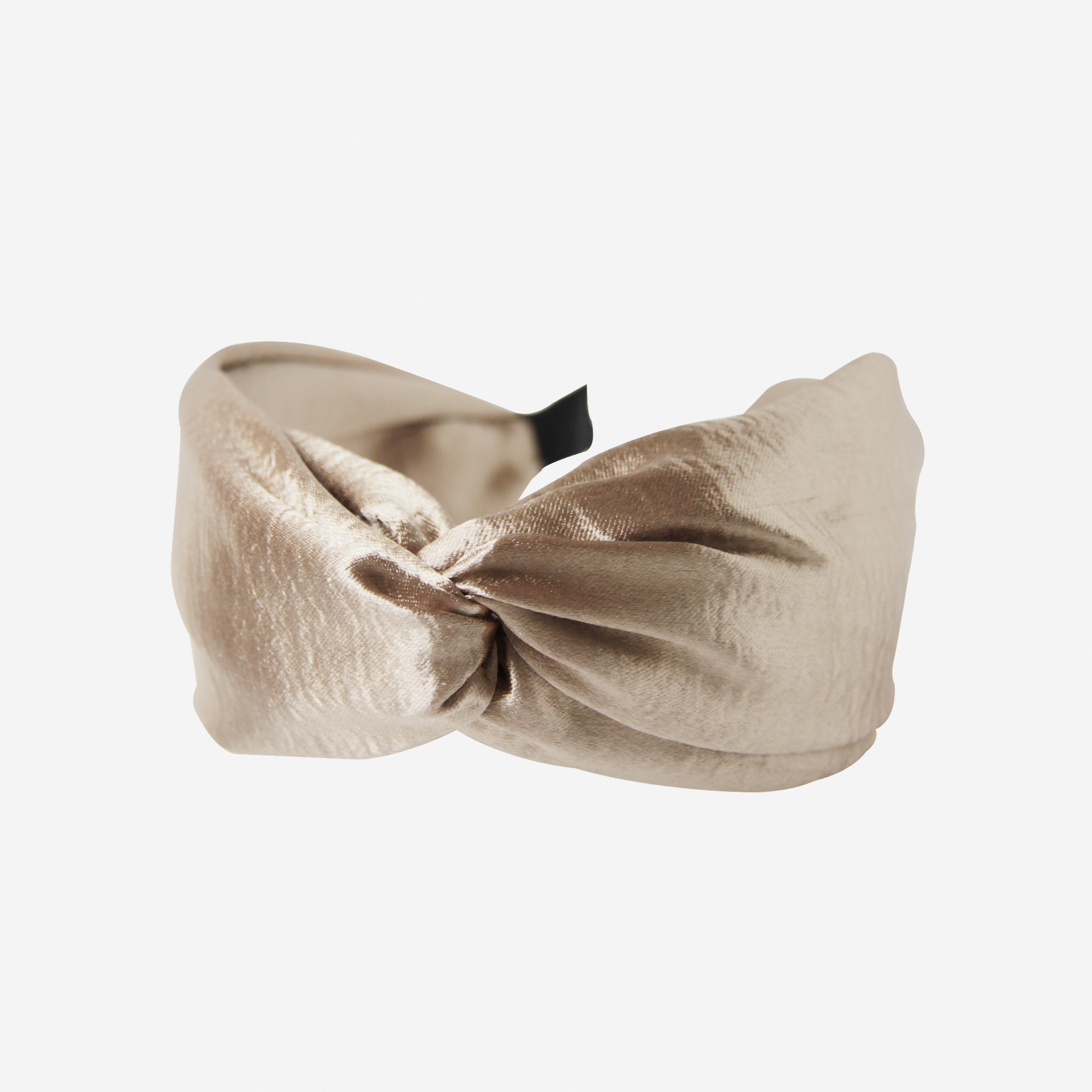 Gold twist headband on an off white background