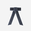 Navy Blue velvet hair bow on an off white background