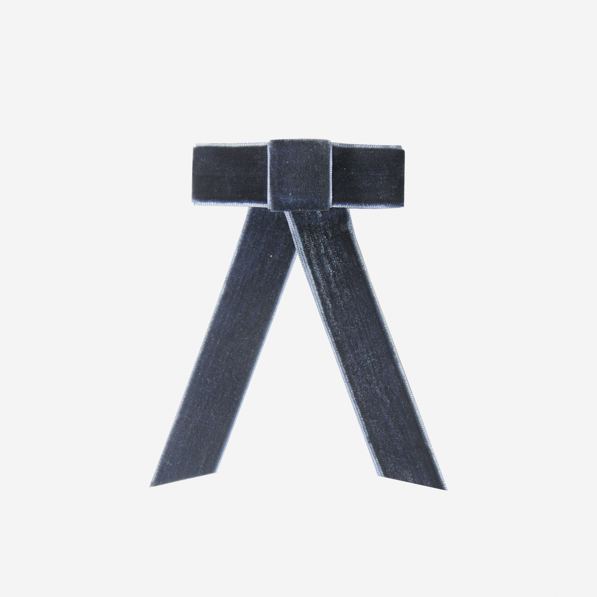 Navy Blue velvet hair bow on an off white background