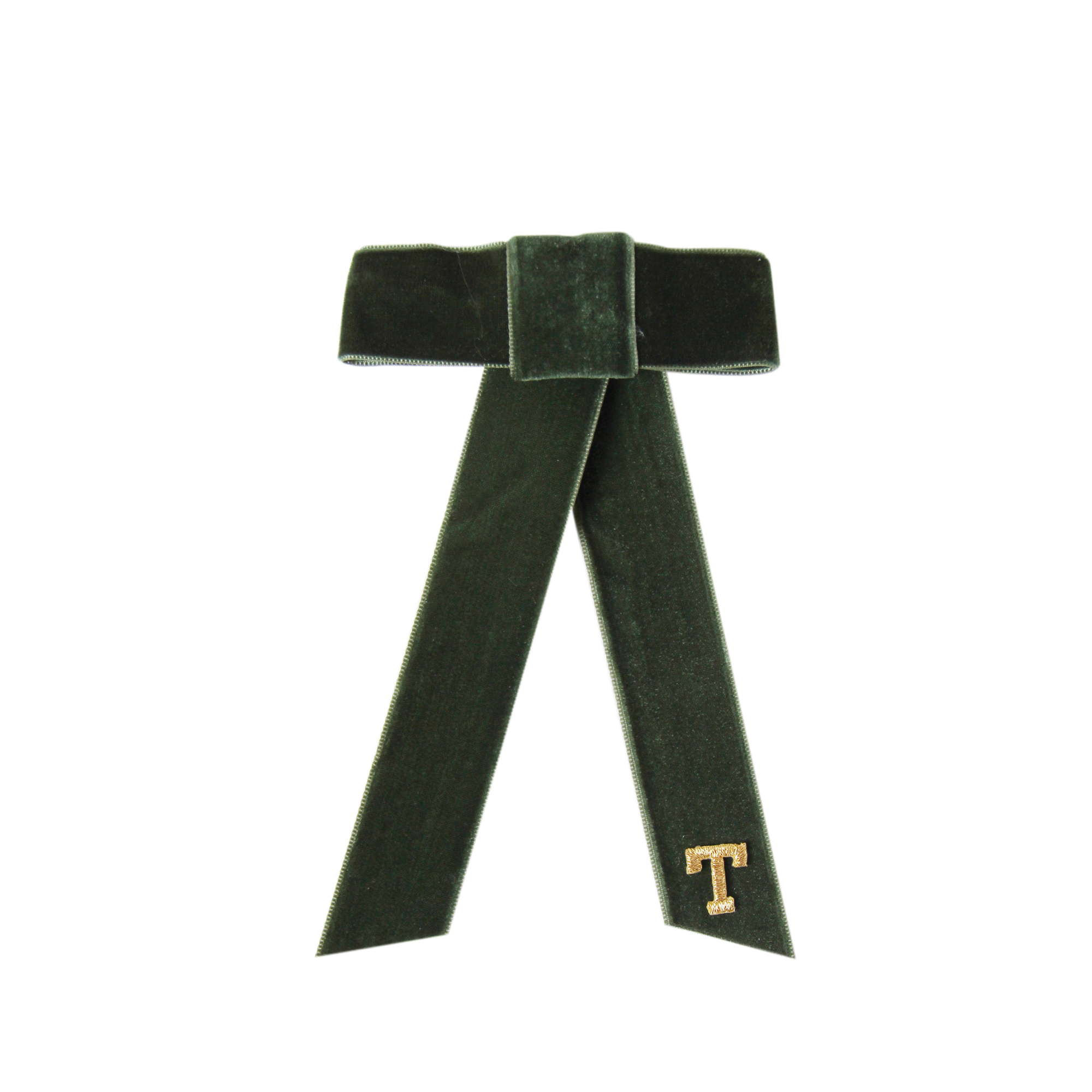 Monogrammed green velvet hair bow with a gold 'T' on a white background