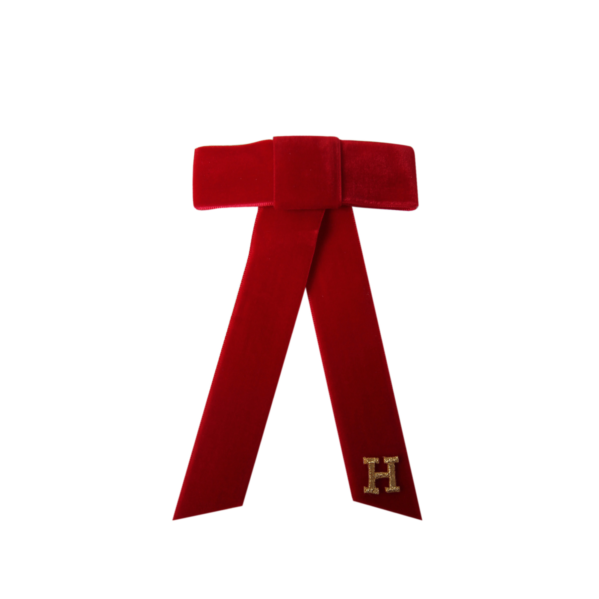 Monogrammed red velvet hair bow with a gold 'H' on a white background