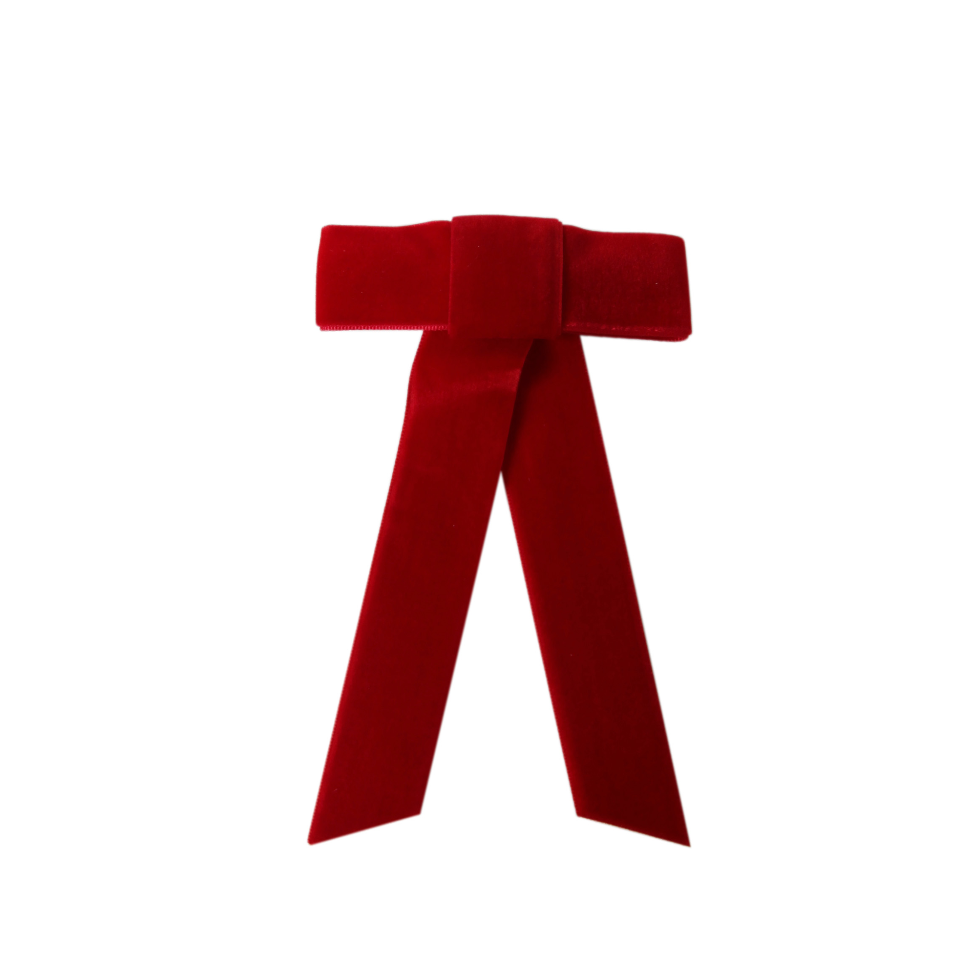 Red velvet hair bow on a white background