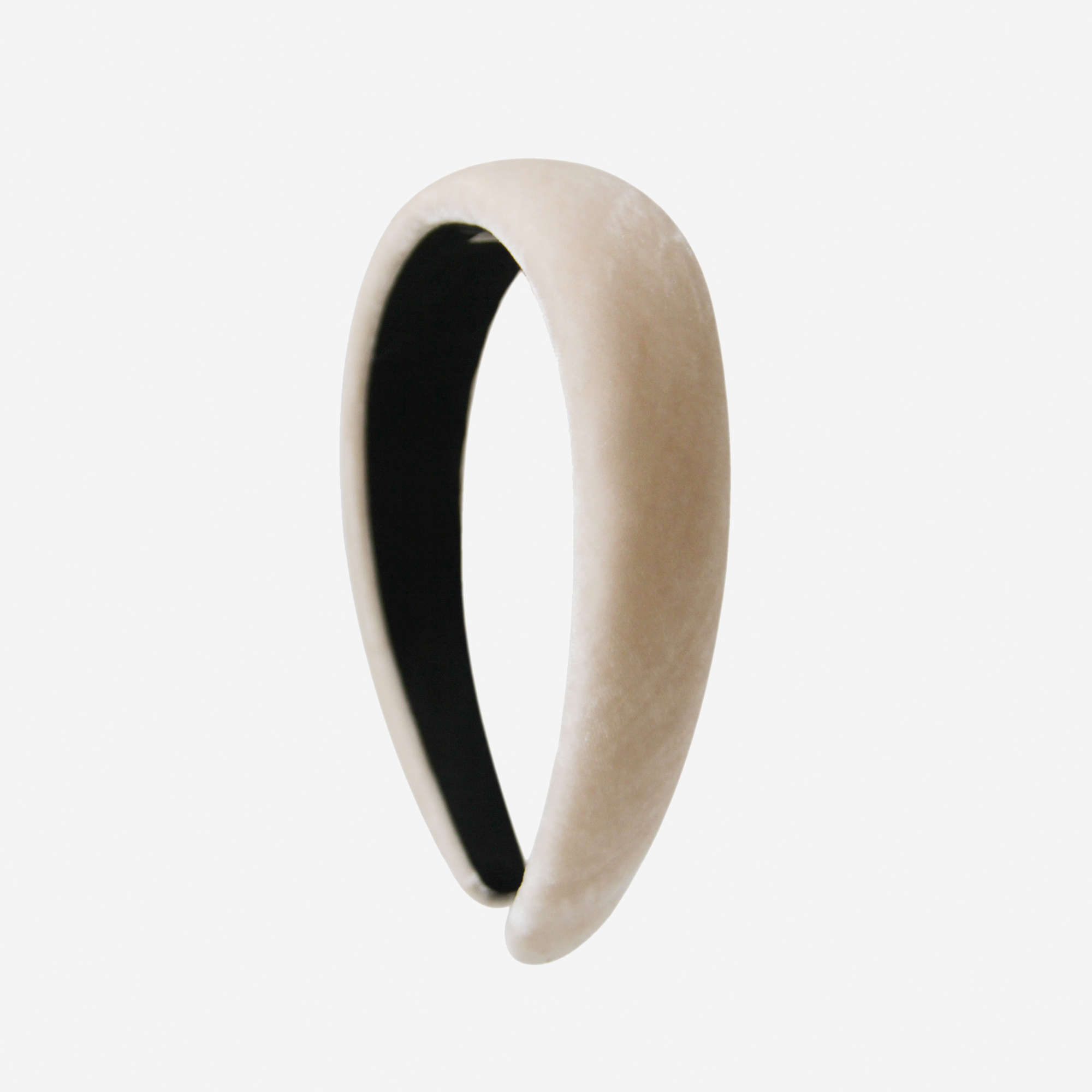 Champagne silk velvet padded headband on an off white background