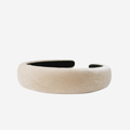 Champagne silk velvet padded headband on an off white background