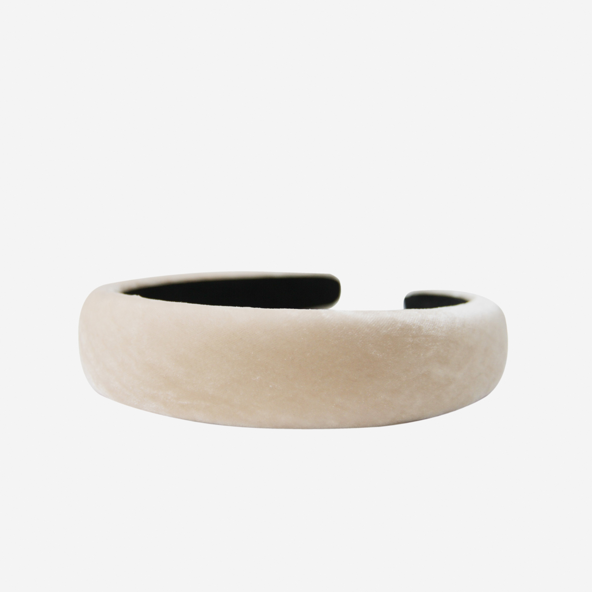Champagne silk velvet padded headband on an off white background