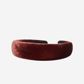 Copper silk velvet padded headband on an off white background