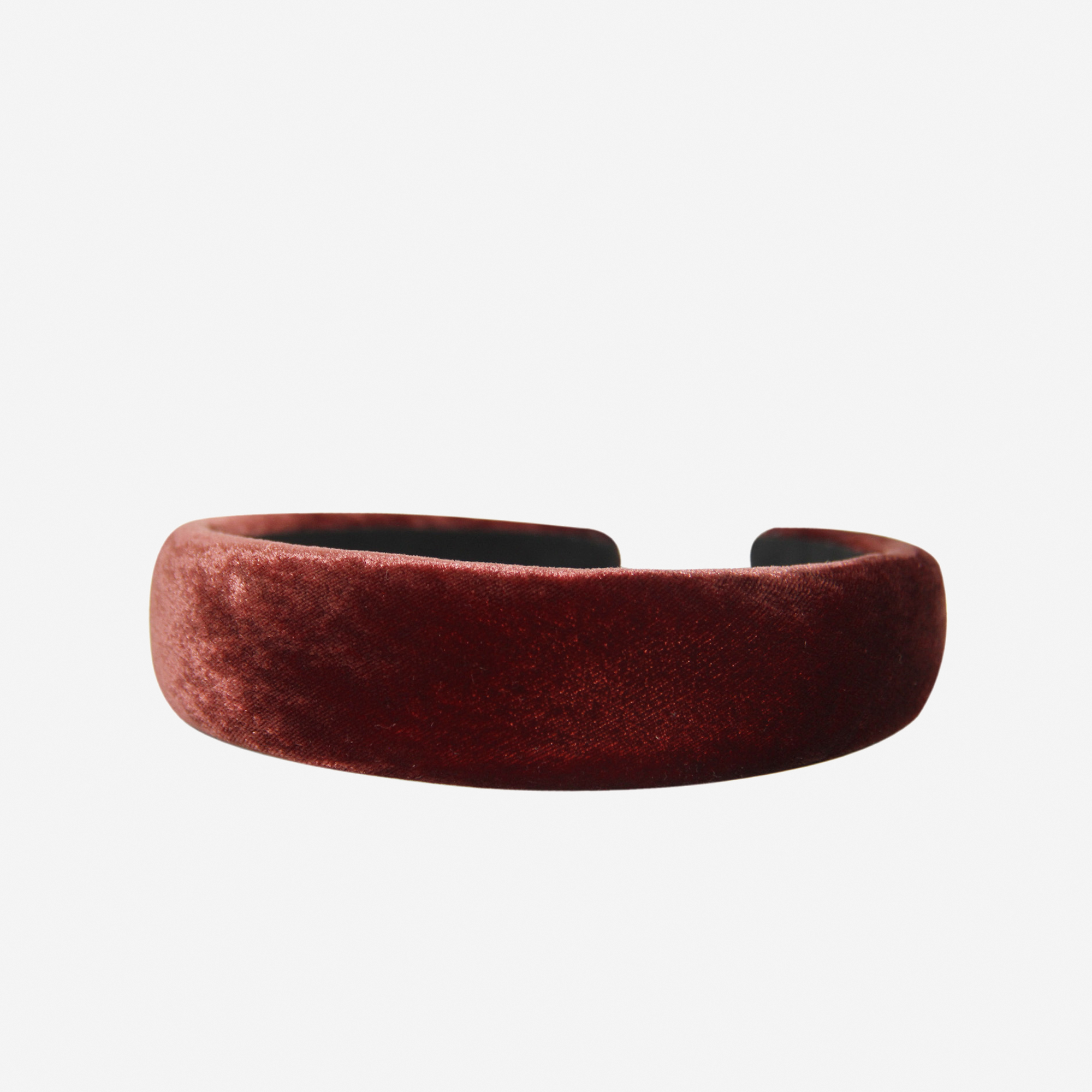 Copper silk velvet padded headband on an off white background