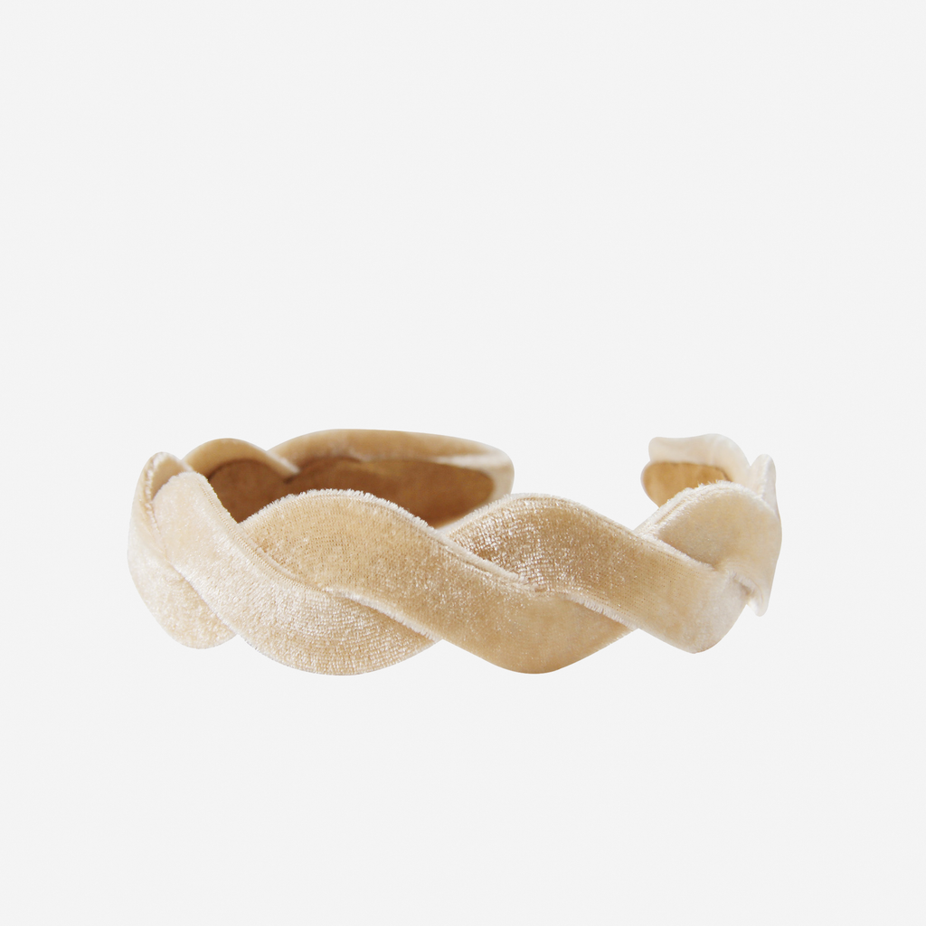 Champagne velvet wave headband on an off white background