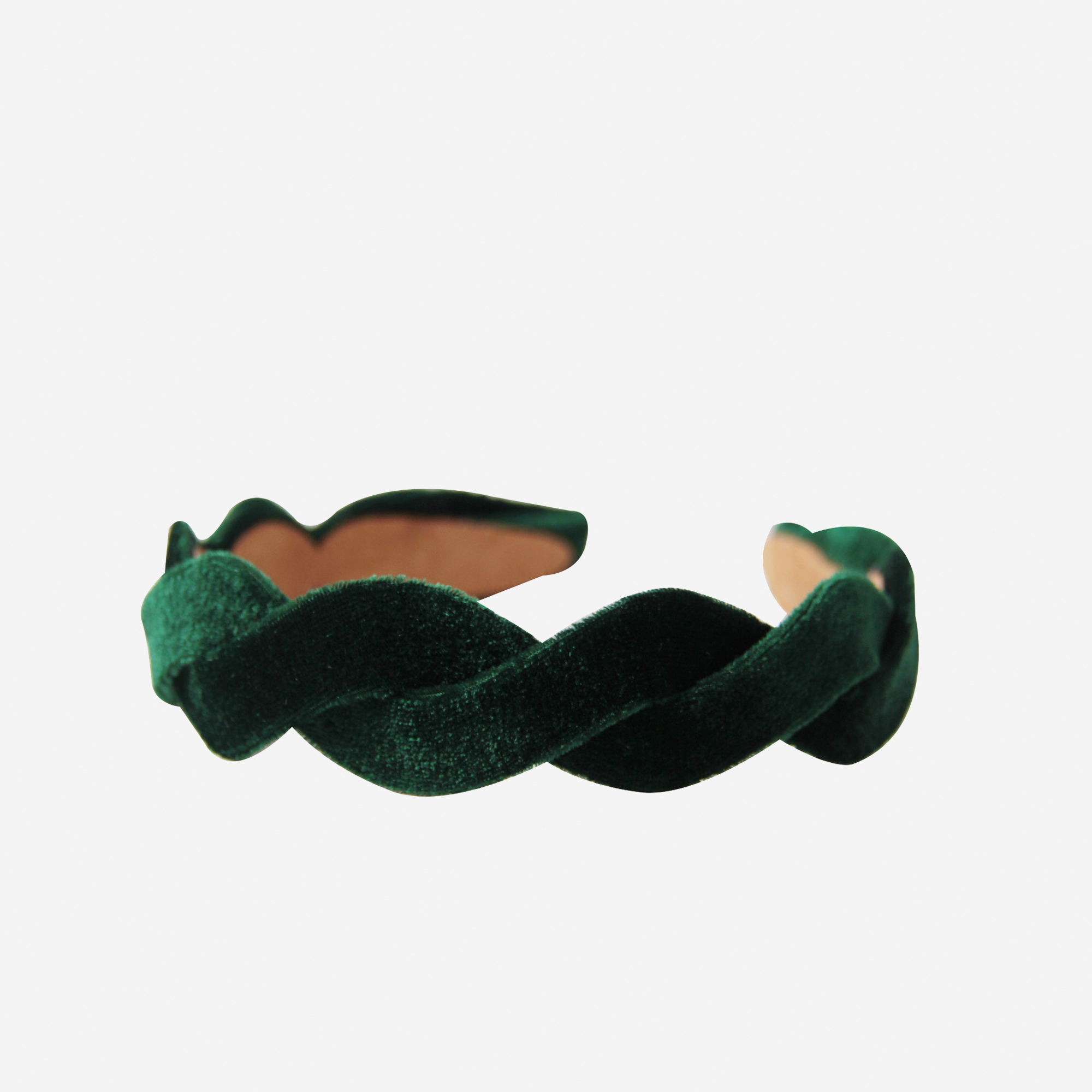 Green velvet wave headband on an off white background