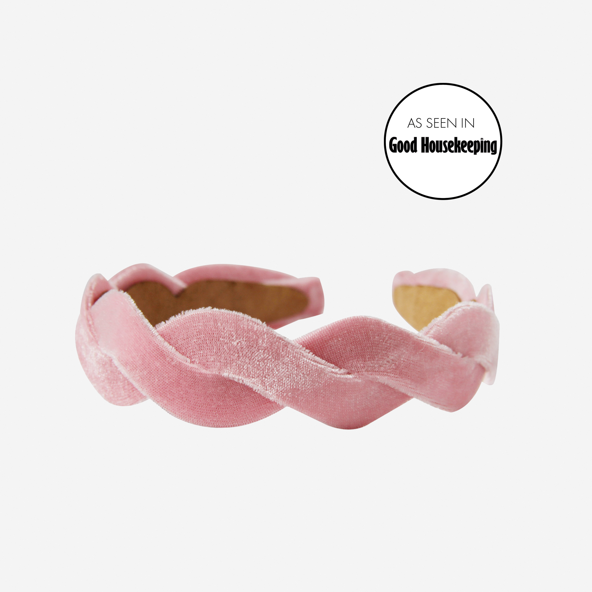 Light pink velvet wave headband on an off white background with an as seen in Good Housekeeping Stamp