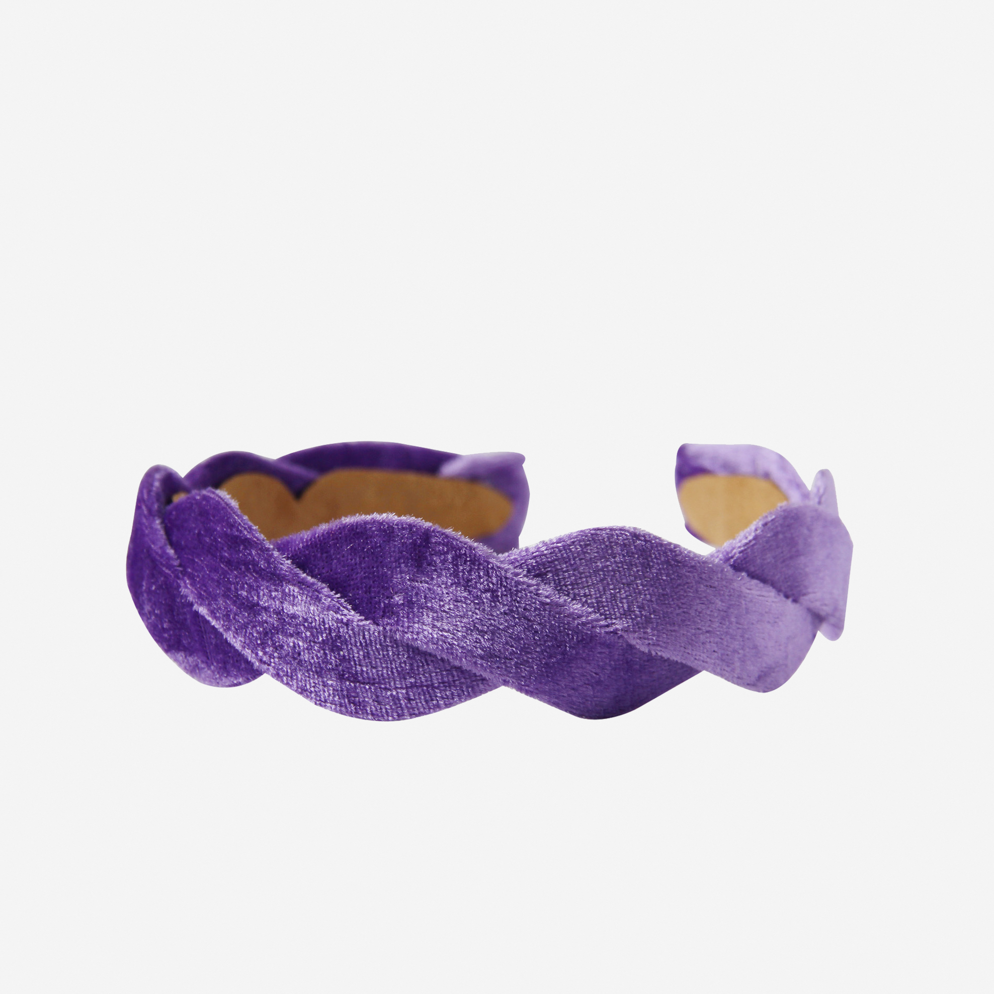 Purple velvet wave headband on an off white background
