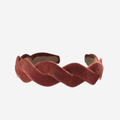 Rust velvet wave headband on an off white background