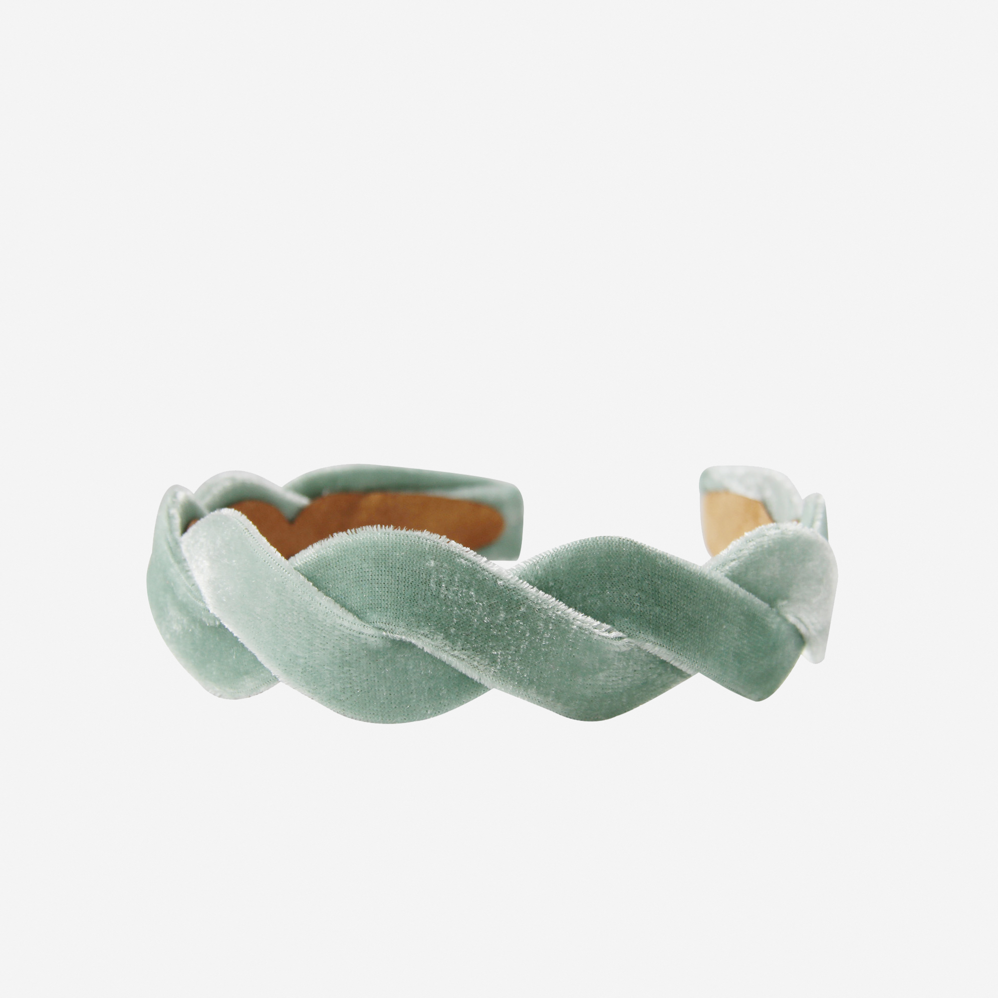 Turquoise velvet wave headband on an off white background