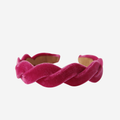 Pink velvet wave headband on an off white background