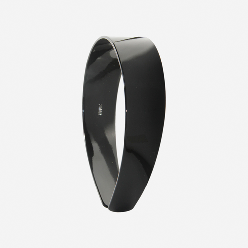 A glossy black resin hairband on a off white background