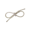 Oversized crystal bow-shaped hair accessory on a white background